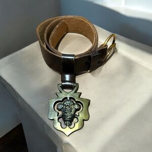 Vintage 1980s black/gold belt, chunky gold closure.